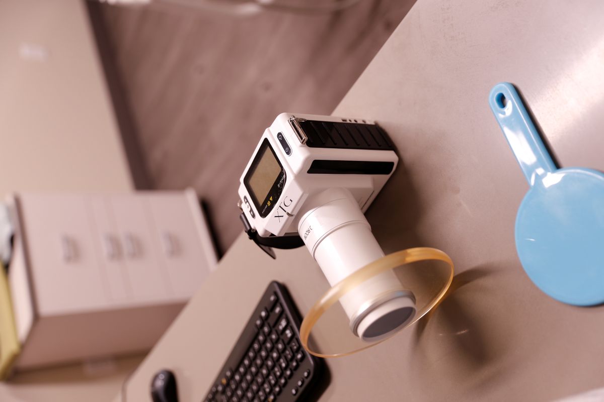 Digital handheld X-ray unit at Endospecialists — used for rapid chairside imaging of traumatic dental injuries